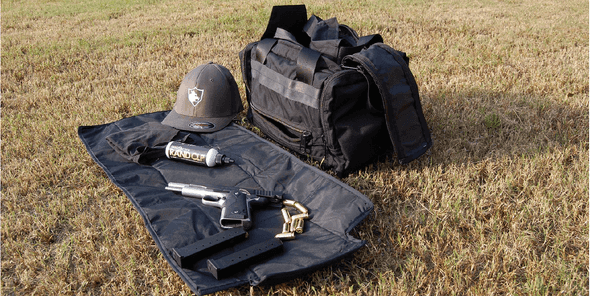 lynx soft case, outdoors with gun on the mat